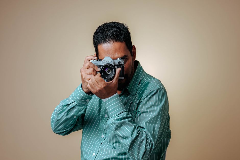 A photographer holding a camera